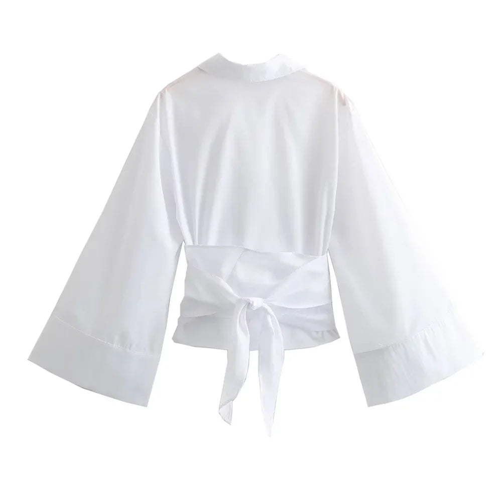 Mjlovers kimono wrap blouse in lightweight fabric, featuring a relaxed fit and elegant design, displayed on a hanger.