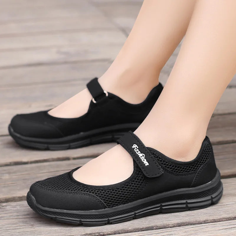 Mjlovers breathable walking shoes in black with cushioned sole, designed for comfort and support during daily walks.