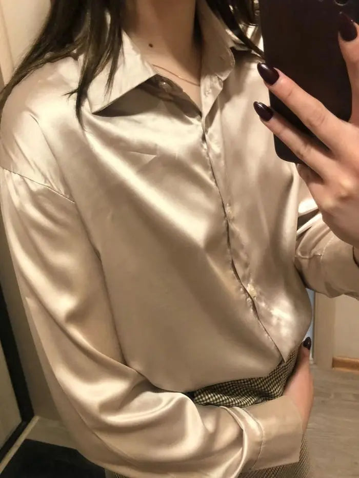 Apricot long sleeve blouse by mjlovers featuring a soft fabric and stylish design, displayed on a hanger.