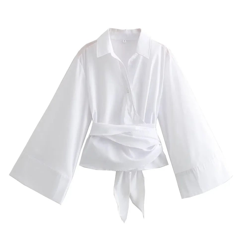 Mjlovers kimono wrap blouse in lightweight fabric, featuring a relaxed fit and elegant design, displayed on a hanger.
