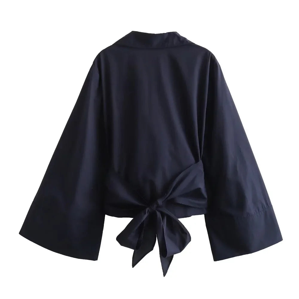 Mjlovers kimono wrap blouse in lightweight fabric with long sleeves and tie-front design, styled on a model.