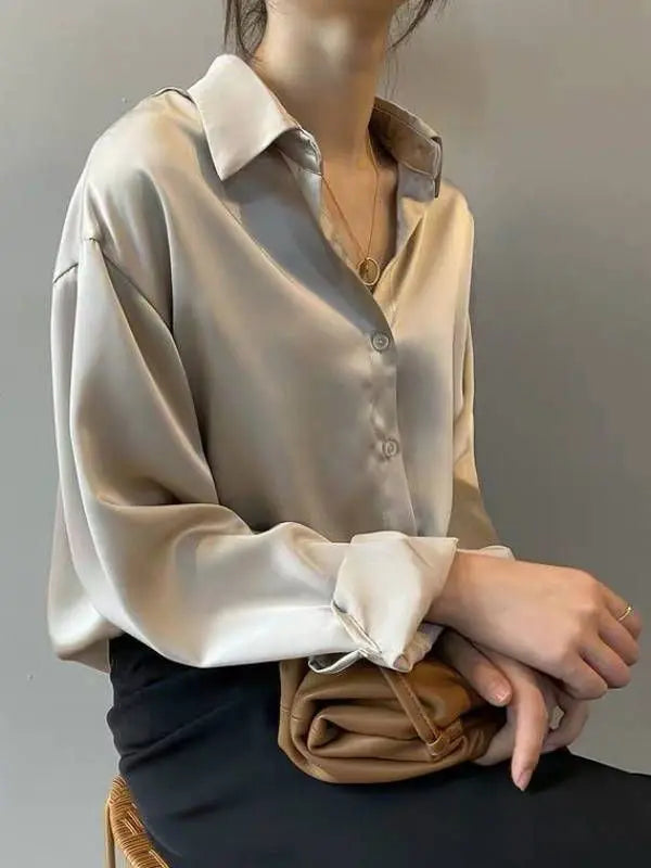 Apricot long sleeve blouse by mjlovers featuring a soft fabric and elegant design, displayed on a hanger.