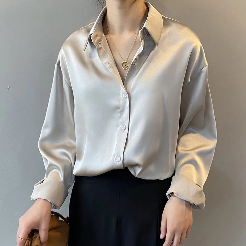 Apricot long sleeve blouse by mjlovers featuring a soft fabric and stylish design, displayed on a hanger.