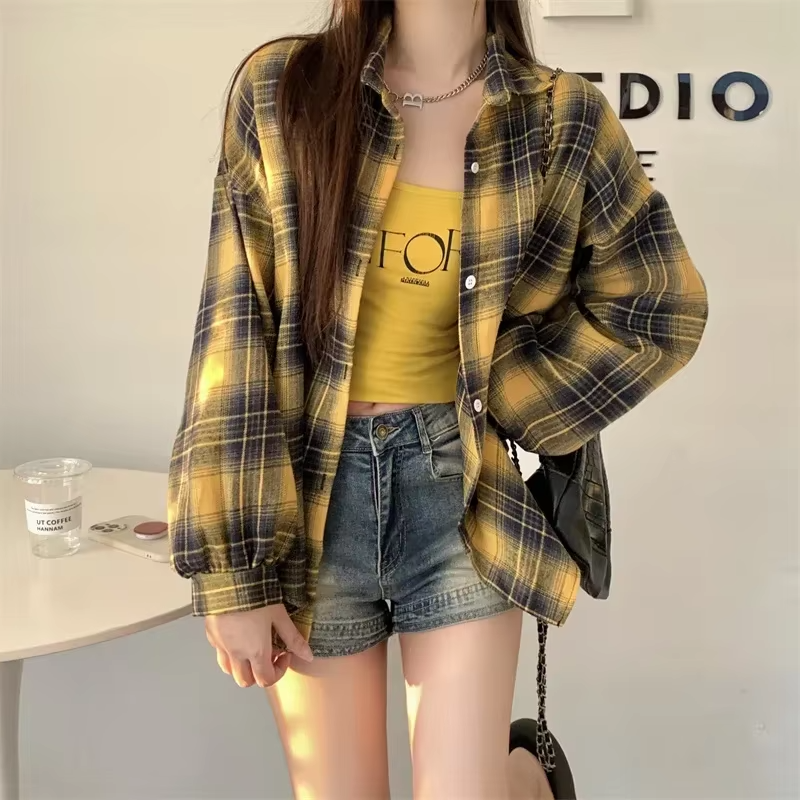 Women's oversized plaid shirt by mjlovers, featuring a classic checkered pattern and relaxed fit in soft fabric.