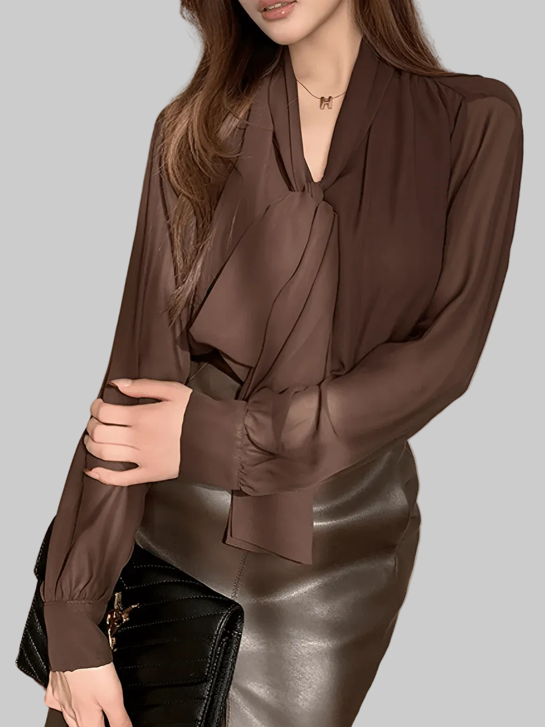Elegant loose women's business shirt by mjlovers, shown in a light-colored fabric with a classic collar and relaxed fit.