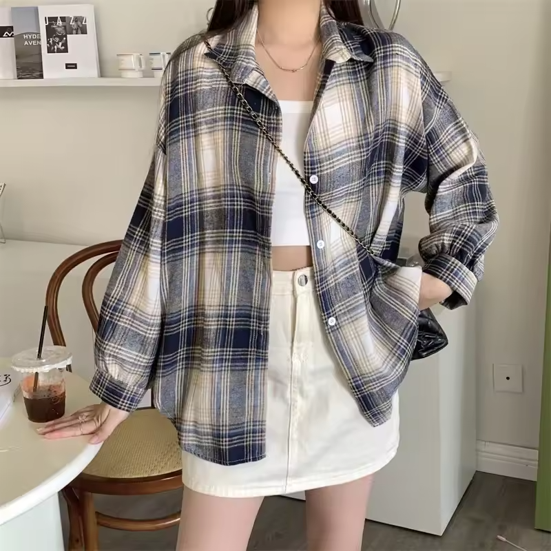 Women's oversized plaid shirt by mjlovers, showing a relaxed fit with classic plaid pattern and button-down front.